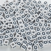 BD00115-02-black-letter-white-opaque-cube-alphabet-beads-single-d-7mm
